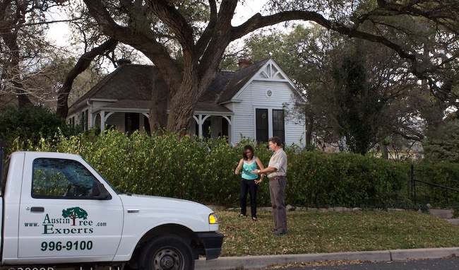 Tree Services 11 Austin Tree Experts arborist consulting with a customer at their home