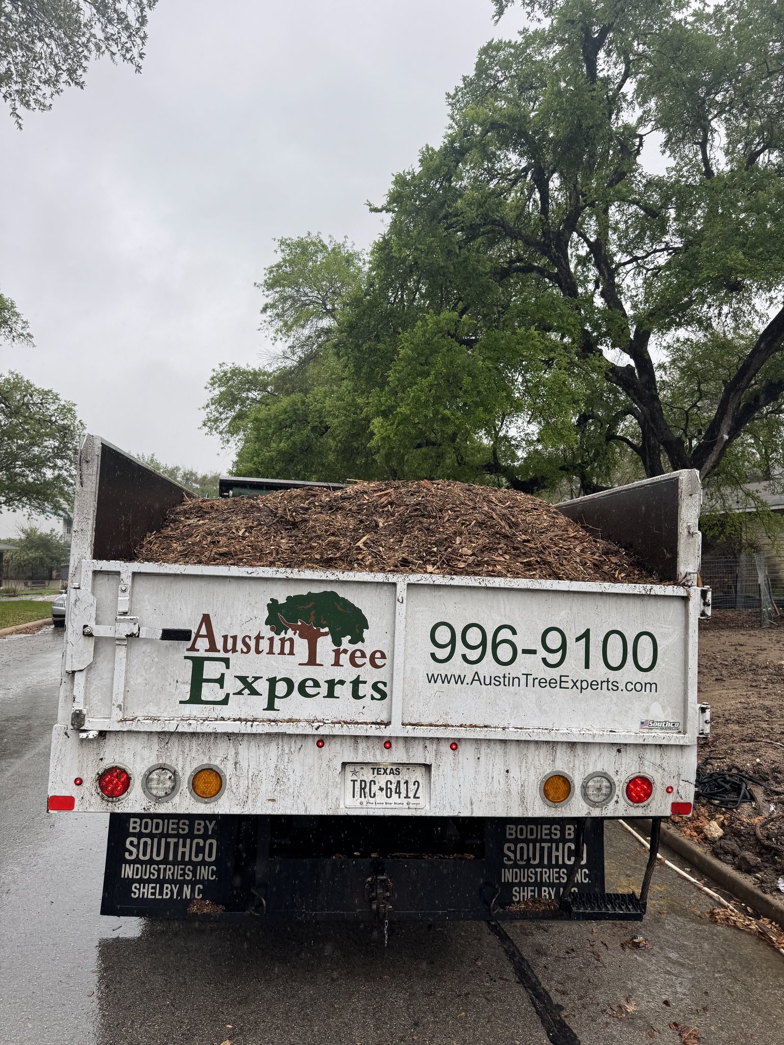 Tree Services 9 Austin Tree Experts chip truck loaded with fresh mulch for delivery