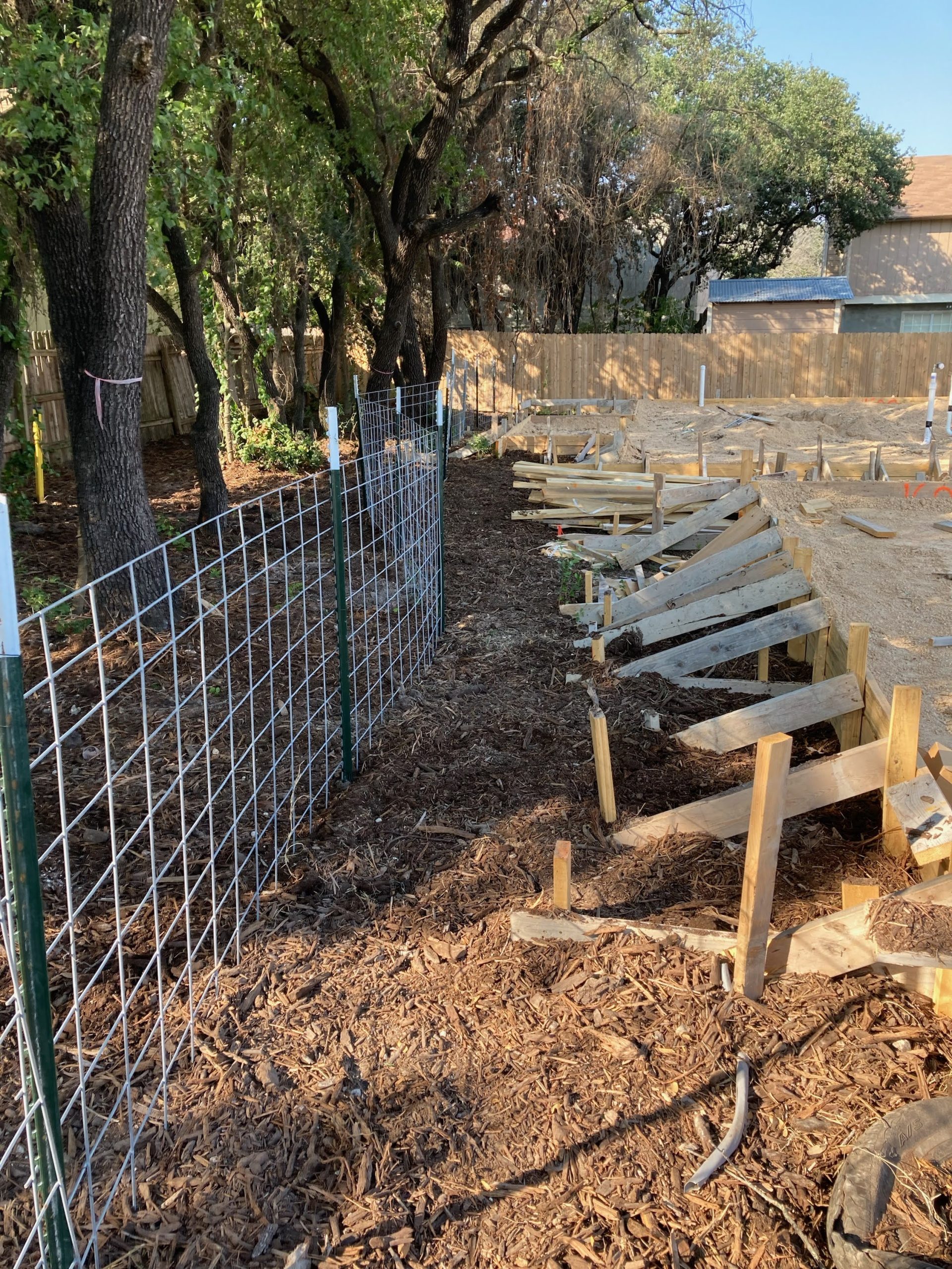 Wire mesh critical root zone protection at residential construction site